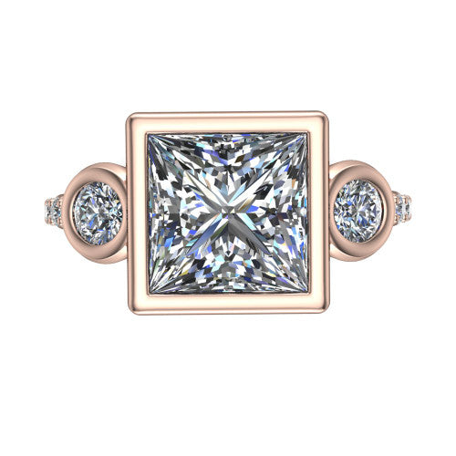 Chloe princess three stone engagement ring in 14K Rose Gold, top-down view showing the bezel-set center flanked by two round side stones in bezels over a pav&eacute; band
