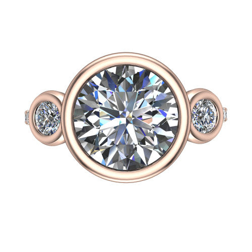 Chloe round three stone engagement ring in 14K Rose Gold, top-down view showing the bezel-set center flanked by two round side stones in bezels over a pav&eacute; band