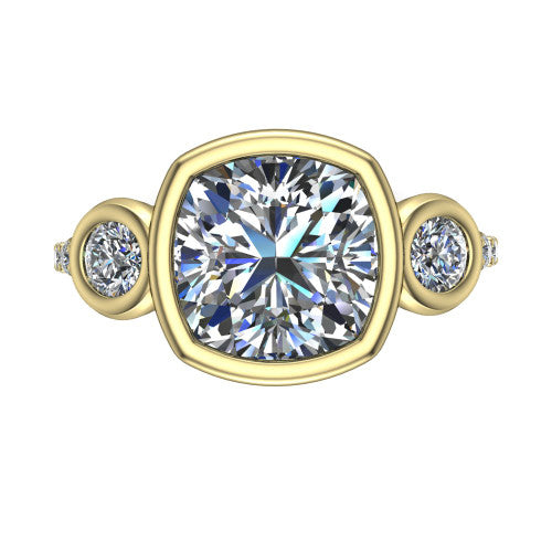 Chloe cushion three stone engagement ring in 14K Yellow Gold, top-down view showing the bezel-set center flanked by two round side stones in bezels over a pav&eacute; band