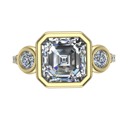 Chloe asscher three stone engagement ring in 18K Yellow Gold, top-down view showing the bezel-set center flanked by two round side stones in bezels over a pav&eacute; band