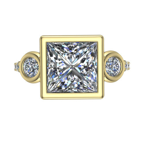 Chloe princess three stone engagement ring in 18K Yellow Gold, top-down view showing the bezel-set center flanked by two round side stones in bezels over a pav&eacute; band