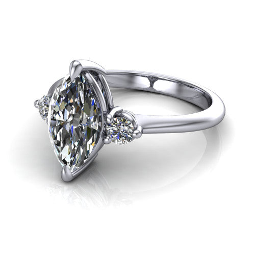 Olive marquise three stone engagement ring in 18K White Gold, three-quarter perspective showing the center diamond between two round side stones on a slim polished band