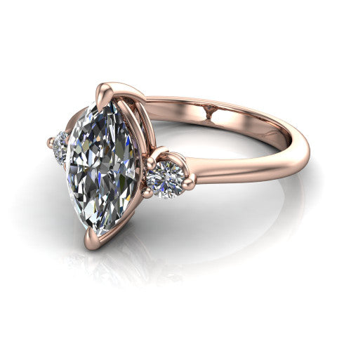 Olive marquise three stone engagement ring in 14K Rose Gold, three-quarter perspective showing the center diamond between two round side stones on a slim polished band
