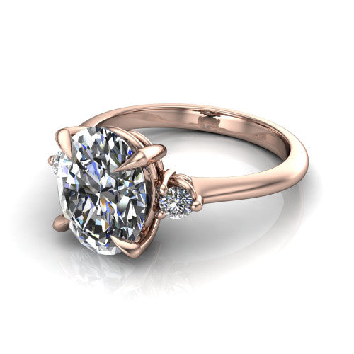 Olive oval three stone engagement ring in 14K Rose Gold, three-quarter perspective showing the center diamond between two round side stones on a slim polished band