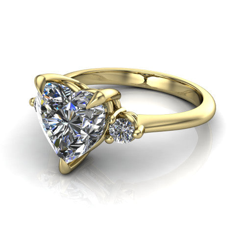 Olive heart three stone engagement ring in 18K Yellow Gold, three-quarter perspective showing the center diamond between two round side stones on a slim polished band