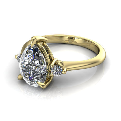 Olive pear three stone engagement ring in 14K Yellow Gold, three-quarter perspective showing the center diamond between two round side stones on a slim polished band