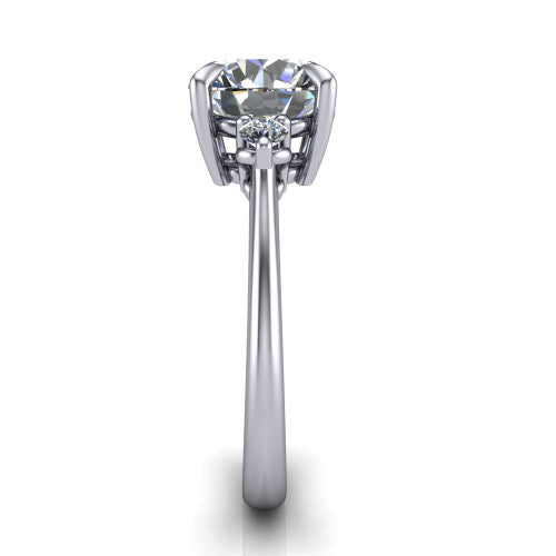 Olive round three stone engagement ring in 18K White Gold, side profile showing the round side stone and the smooth tapered polished band