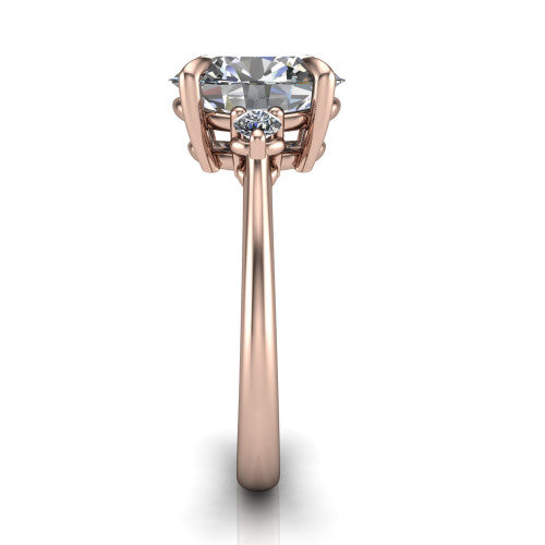 Olive oval three stone engagement ring in 14K Rose Gold, side profile showing the round side stone and the smooth tapered polished band