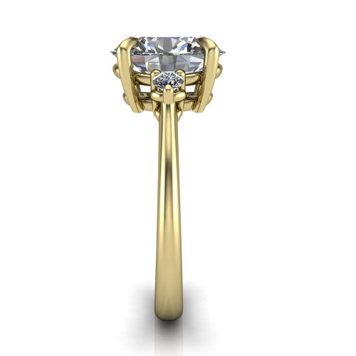 Olive oval three stone engagement ring in 14K Yellow Gold, side profile showing the round side stone and the smooth tapered polished band