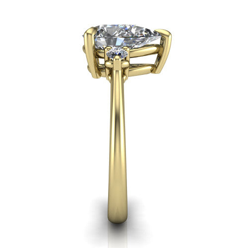 Olive pear three stone engagement ring in 14K Yellow Gold, side profile showing the round side stone and the smooth tapered polished band