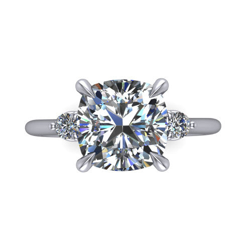 Olive cushion three stone engagement ring in 18K White Gold, top-down view showing the center diamond flanked by two round side stones in a classic three stone setting