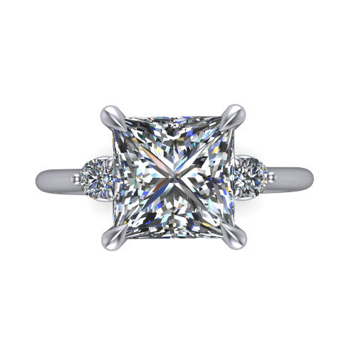 Olive princess three stone engagement ring in Platinum, top-down view showing the center diamond flanked by two round side stones in a classic three stone setting
