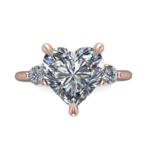 Olive heart three stone engagement ring in 18K Rose Gold, top-down view showing the center diamond flanked by two round side stones in a classic three stone setting