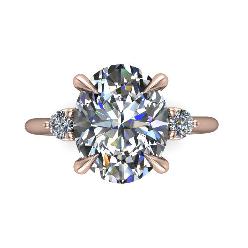 Olive oval three stone engagement ring in 14K Rose Gold, top-down view showing the center diamond flanked by two round side stones in a classic three stone setting