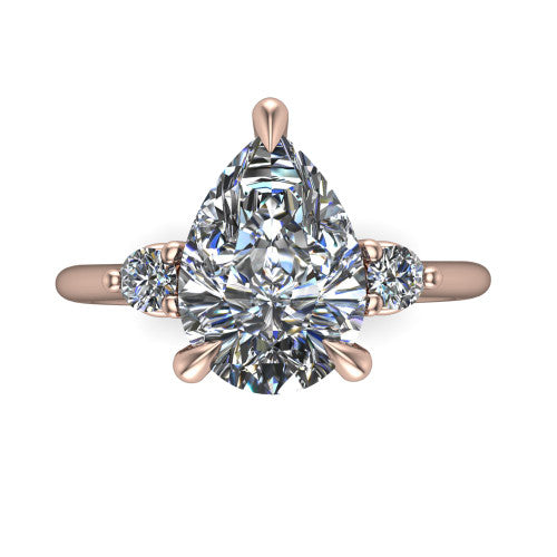 Olive pear three stone engagement ring in 18K Rose Gold, top-down view showing the center diamond flanked by two round side stones in a classic three stone setting