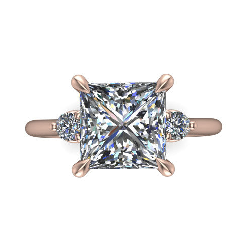 Olive princess three stone engagement ring in 14K Rose Gold, top-down view showing the center diamond flanked by two round side stones in a classic three stone setting