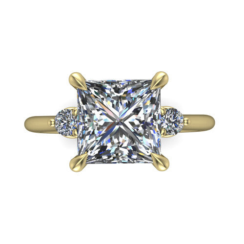 Olive princess three stone engagement ring in 14K Yellow Gold, top-down view showing the center diamond flanked by two round side stones in a classic three stone setting
