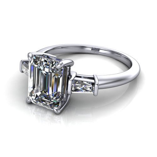 Jade emerald three stone engagement ring in Platinum with tapered baguette side stones, three-quarter perspective view