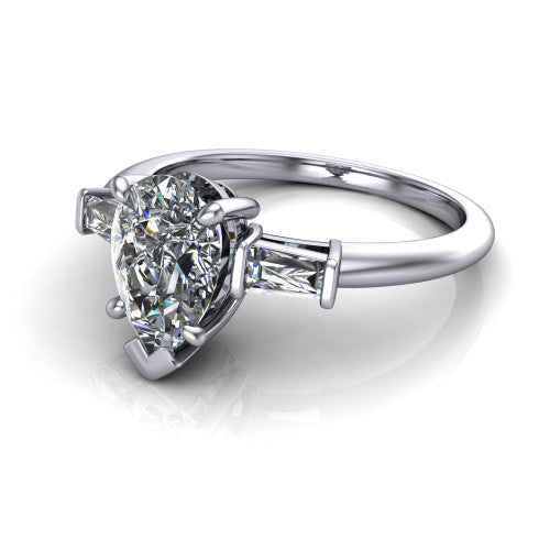 Jade pear three stone engagement ring in 14K White Gold with tapered baguette side stones, three-quarter perspective view