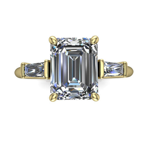 Jade emerald three stone engagement ring in 14K Yellow Gold with tapered baguette side stones, top-down view of the center stone and tapered baguette side stones