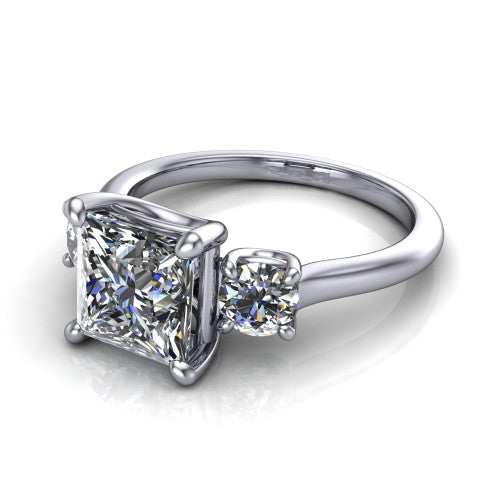 Emma princess three stone engagement ring in 14K White Gold, three-quarter perspective showing the center diamond between two round side stones on a slim polished band