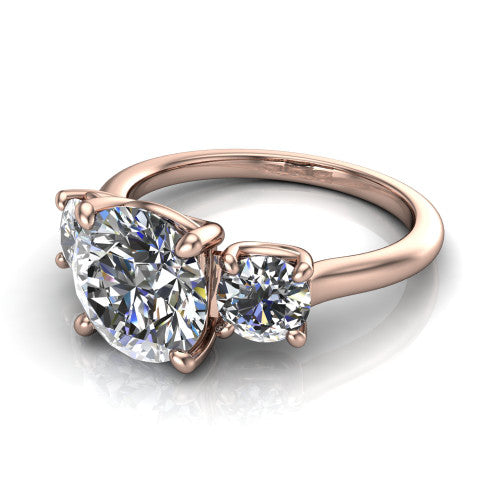 Emma round three stone engagement ring in 18K Rose Gold, three-quarter perspective showing the center diamond between two round side stones on a slim polished band