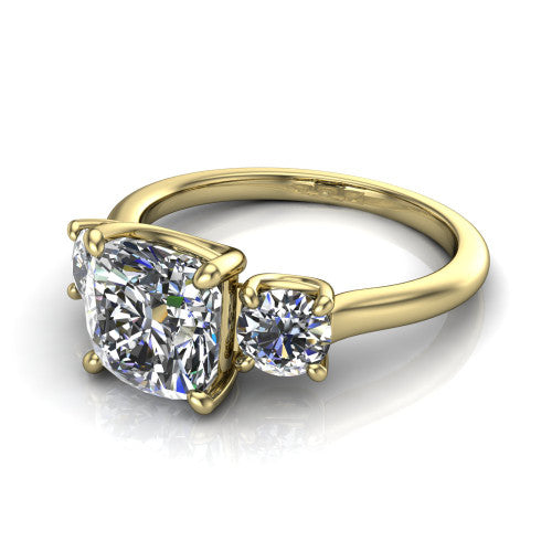 Emma cushion three stone engagement ring in 14K Yellow Gold, three-quarter perspective showing the center diamond between two round side stones on a slim polished band