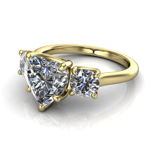 Emma heart three stone engagement ring in 18K Yellow Gold, three-quarter perspective showing the center diamond between two round side stones on a slim polished band