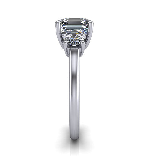 Emma asscher three stone engagement ring in Platinum, side profile showing the round side stone and the smooth tapered polished band