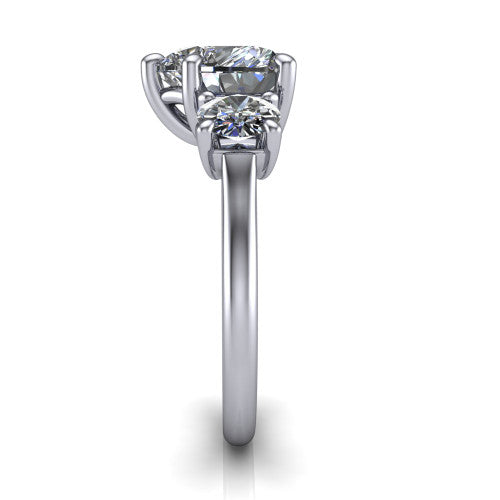Emma heart three stone engagement ring in 18K White Gold, side profile showing the round side stone and the smooth tapered polished band