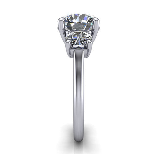 Emma round three stone engagement ring in 14K White Gold, side profile showing the round side stone and the smooth tapered polished band