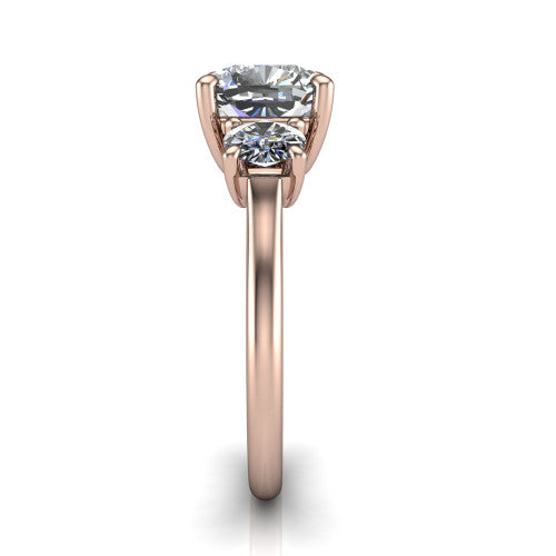 Emma cushion three stone engagement ring in 14K Rose Gold, side profile showing the round side stone and the smooth tapered polished band