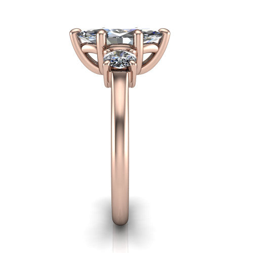 Emma marquise three stone engagement ring in 14K Rose Gold, side profile showing the round side stone and the smooth tapered polished band