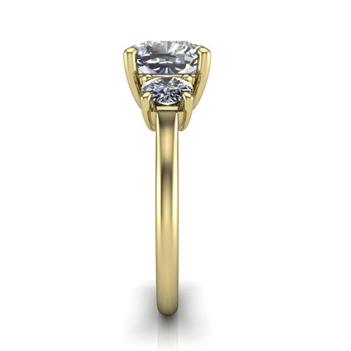 Emma cushion three stone engagement ring in 18K Yellow Gold, side profile showing the round side stone and the smooth tapered polished band
