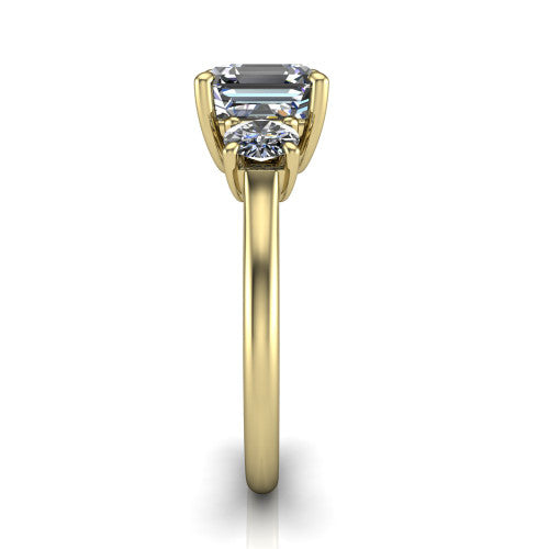 Emma asscher three stone engagement ring in 14K Yellow Gold, side profile showing the round side stone and the smooth tapered polished band