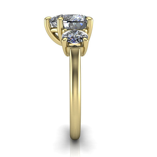 Emma heart three stone engagement ring in 14K Yellow Gold, side profile showing the round side stone and the smooth tapered polished band