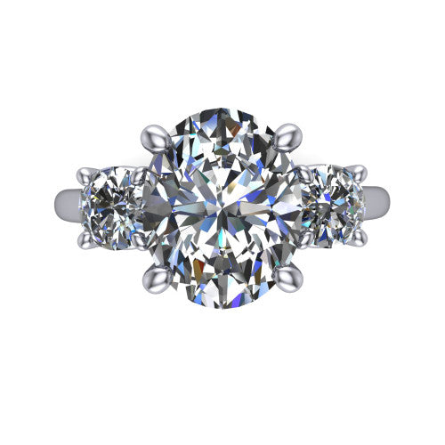 Emma oval three stone engagement ring in 18K White Gold, top-down view showing the center diamond flanked by two round side stones in a classic three stone setting