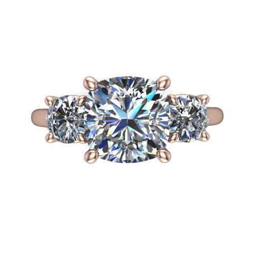 Emma cushion three stone engagement ring in 14K Rose Gold, top-down view showing the center diamond flanked by two round side stones in a classic three stone setting