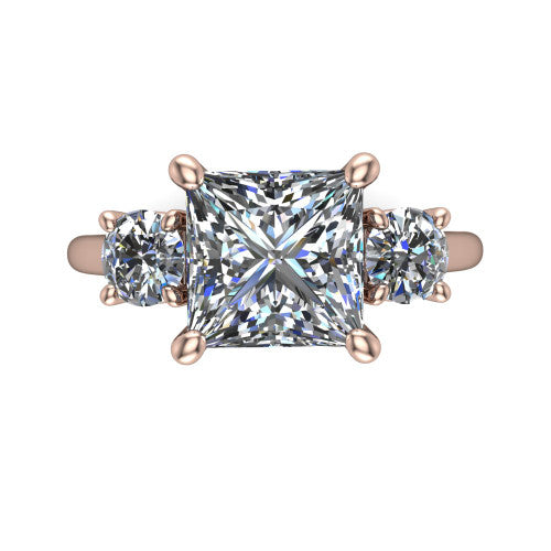 Emma princess three stone engagement ring in 14K Rose Gold, top-down view showing the center diamond flanked by two round side stones in a classic three stone setting