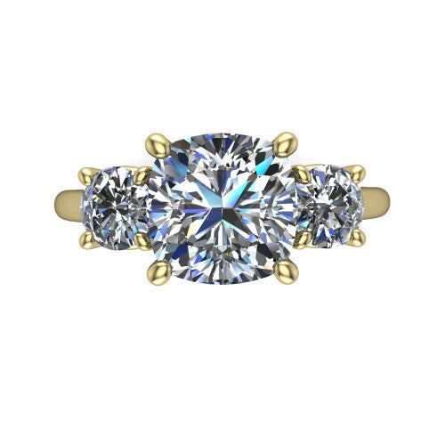 Emma cushion three stone engagement ring in 18K Yellow Gold, top-down view showing the center diamond flanked by two round side stones in a classic three stone setting