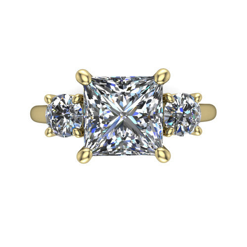 Emma princess three stone engagement ring in 18K Yellow Gold, top-down view showing the center diamond flanked by two round side stones in a classic three stone setting