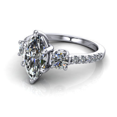 Celeste marquise three stone engagement ring in Platinum, three-quarter perspective showing the center diamond between two round side stones above a pav&eacute; shank