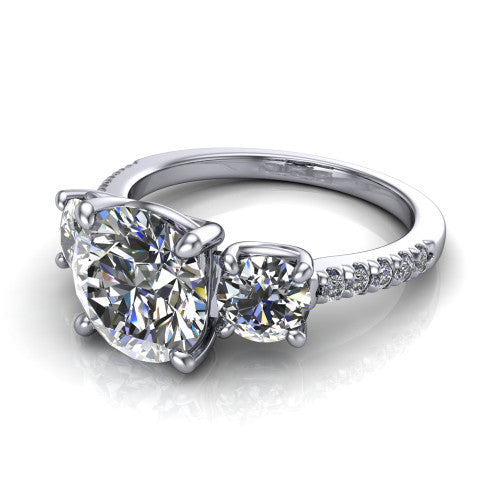 Celeste round three stone engagement ring in 14K White Gold, three-quarter perspective showing the center diamond between two round side stones above a pav&eacute; shank