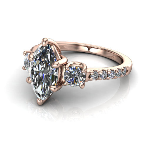 Celeste marquise three stone engagement ring in 14K Rose Gold, three-quarter perspective showing the center diamond between two round side stones above a pav&eacute; shank