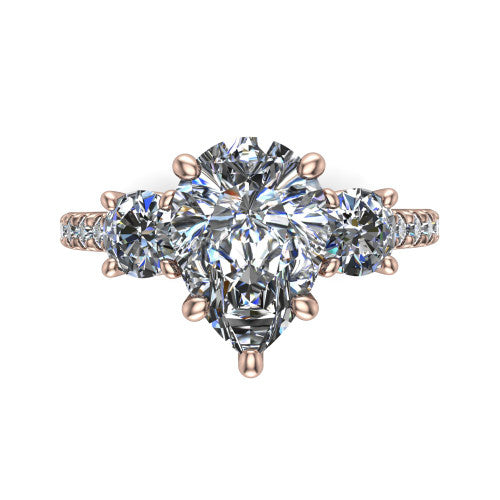 Celeste pear three stone engagement ring in 14K Rose Gold, top-down view showing the center diamond flanked by two round side stones in a classic three stone setting