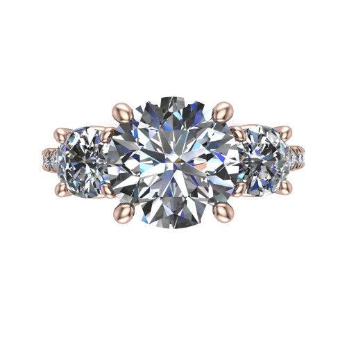 Celeste round three stone engagement ring in 18K Rose Gold, top-down view showing the center diamond flanked by two round side stones in a classic three stone setting