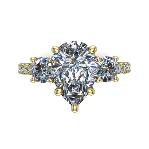Celeste pear three stone engagement ring in 14K Yellow Gold, top-down view showing the center diamond flanked by two round side stones in a classic three stone setting