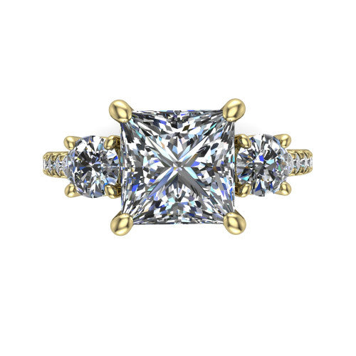 Celeste princess three stone engagement ring in 18K Yellow Gold, top-down view showing the center diamond flanked by two round side stones in a classic three stone setting