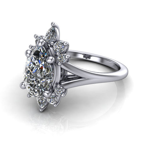 Sage pear halo engagement ring in 18K White Gold, three-quarter perspective showing the center framed by a vintage cluster halo of pear and round diamonds above a split shank
