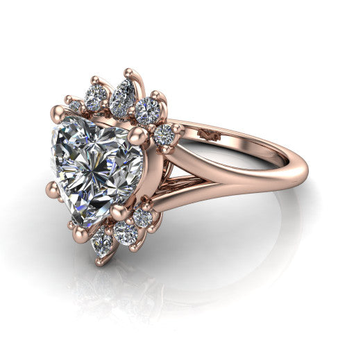Sage heart halo engagement ring in 18K Rose Gold, three-quarter perspective showing the center framed by a vintage cluster halo of pear and round diamonds above a split shank